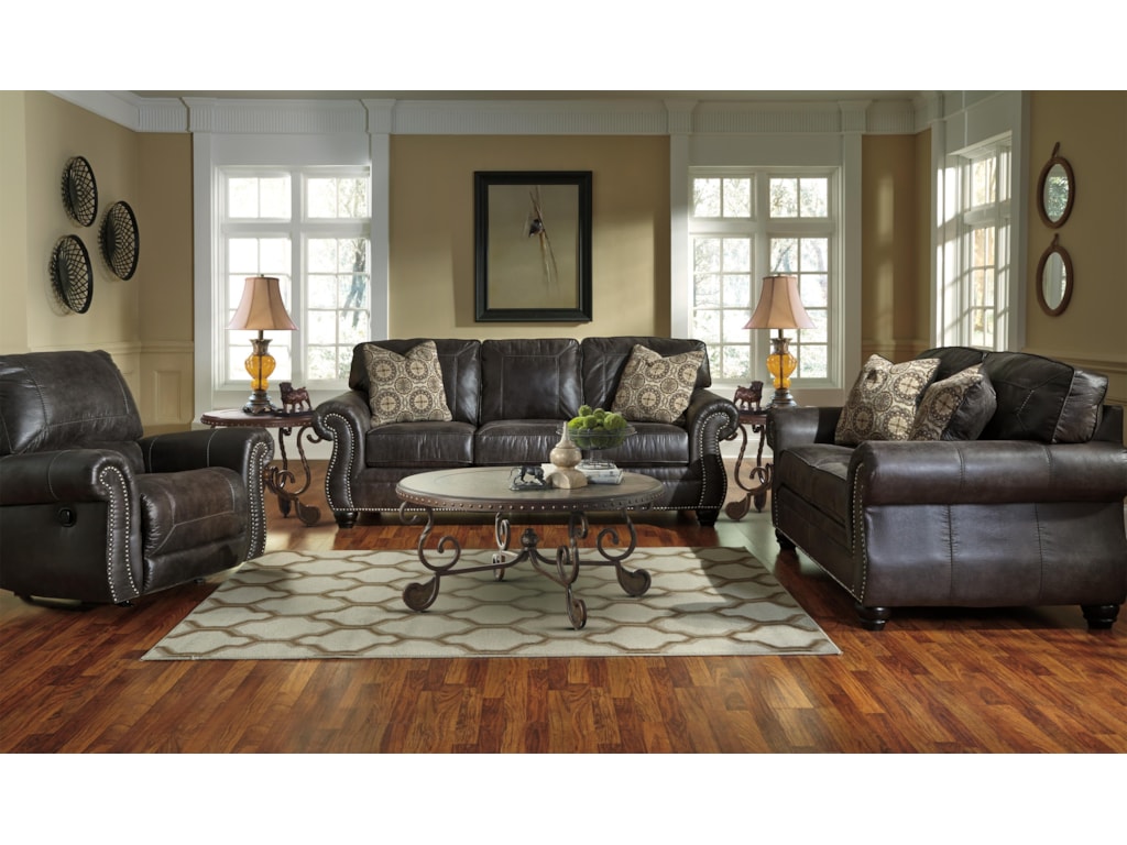 Breville Faux Leather Sofa With Rolled Arms And Nailhead Trim By Benchcraft At Zak S Home