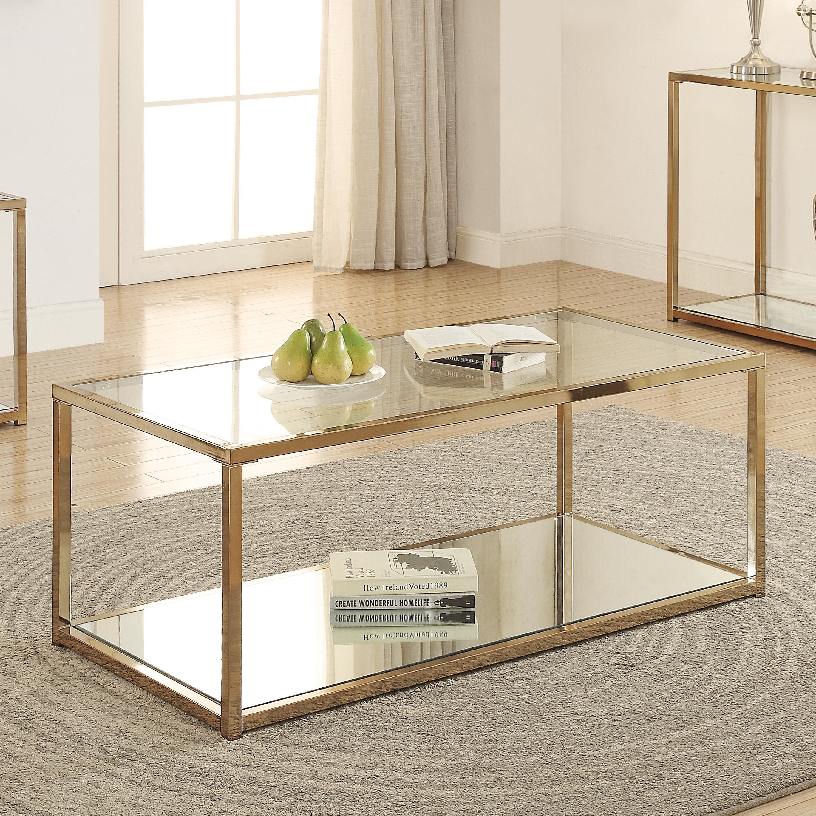 Coaster Calantha Coffee Table With Mirror Shelf Value City Furniture Cocktail Coffee Tables A clear, tempered glass top is featured, along with a mirrored storage shelf that sits underneath. value city furniture