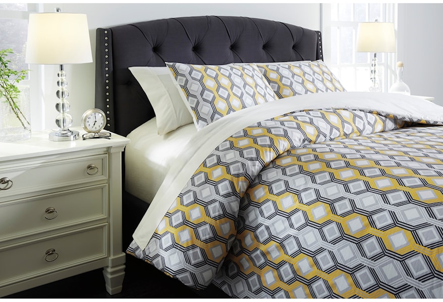 yellow and gray flower comforter