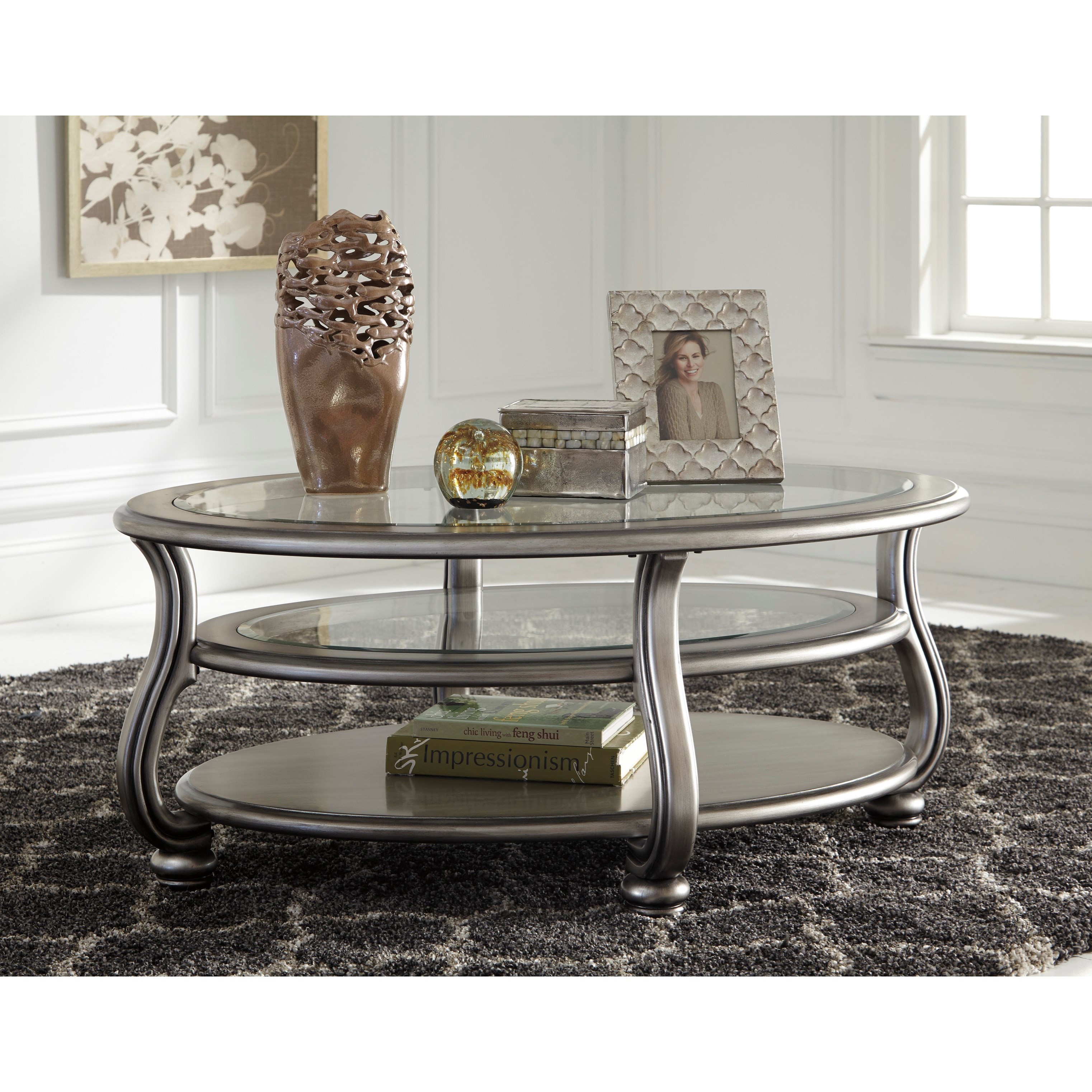 Signature Design By Ashley Coralayne Oval Cocktail Table In Silver