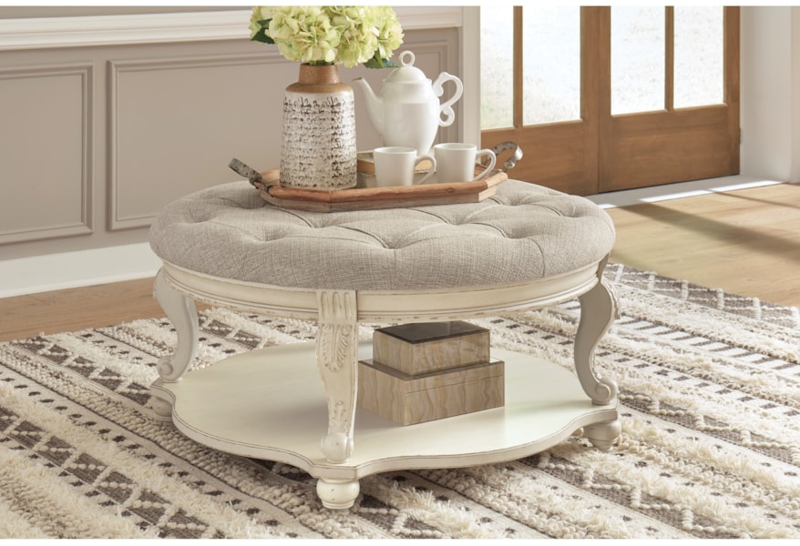 Signature Design By Ashley Realyn Cottage Round Ottoman Cocktail Table Lindy S Furniture Company Ottomans
