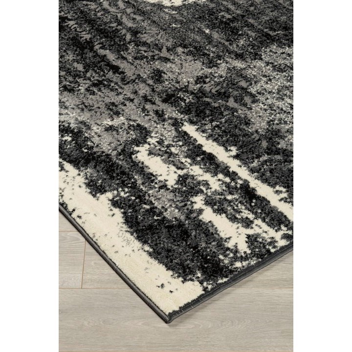 Ashley Signature Design Contemporary Area Rugs R402702 Roskos Black Gray Medium Rug Dunk Bright Furniture Rugs