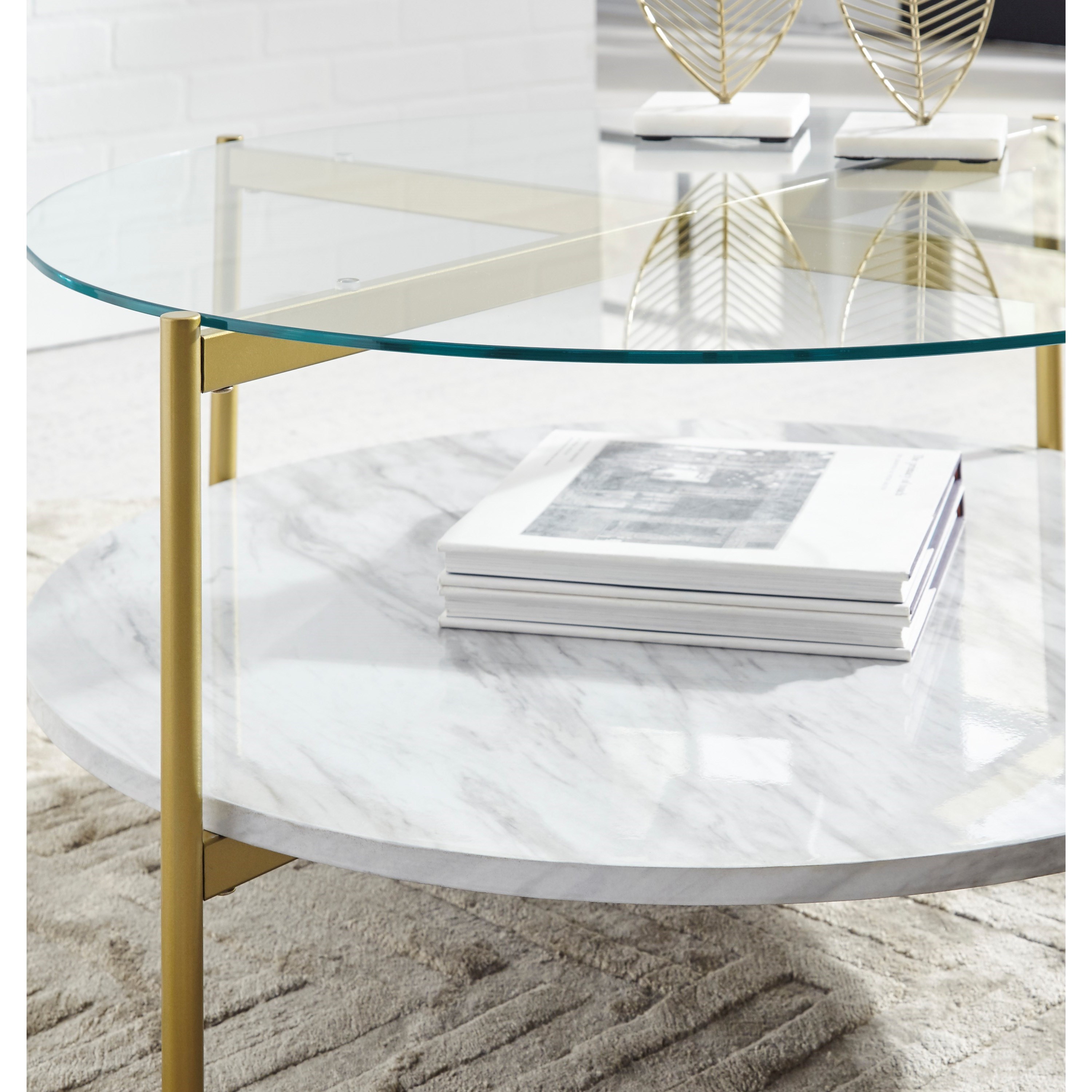 Signature Design By Ashley Wynora T192 8 Gold Finish Round Cocktail Table With Glass Top And Faux Marble Shelf Beck S Furniture Cocktail Coffee Tables