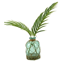 Cycas Palm Fronds in Blue Glass Bottle
