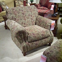 Rolled arm and back chair with nail head trim