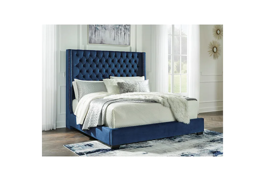 The Coralayne Blue Queen Upholstered Bed is available at Complete