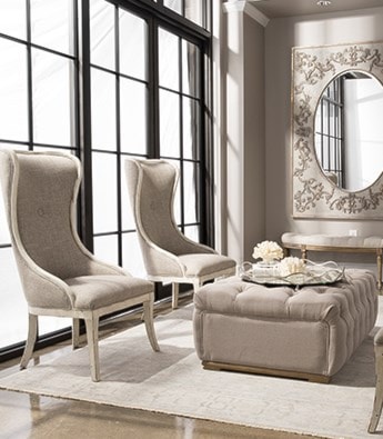 Two chairs and an ottoman in an elegant room