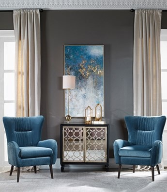 Two blue chairs and a mirrored cabinet