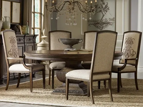 7-piece dining set with 6 upholstered side chairs and a round dining table with a pedestal base