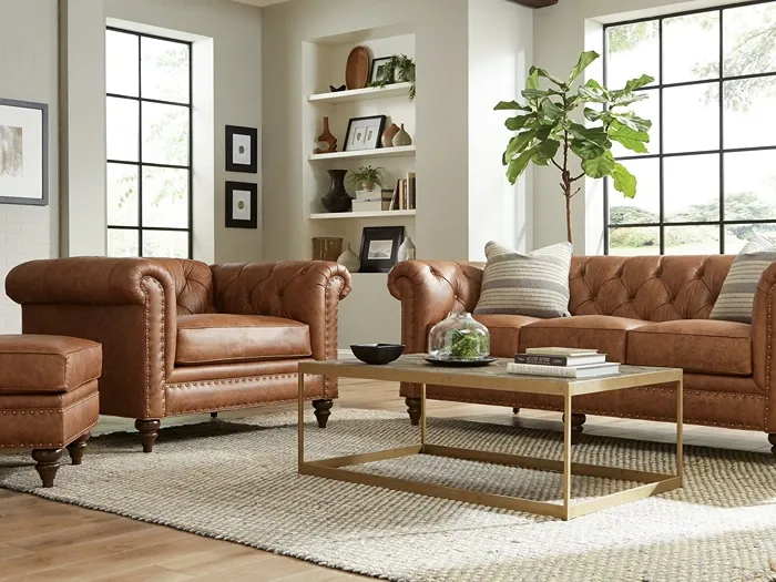 button tufted brown leather sofa with matching arm chair and ottoman