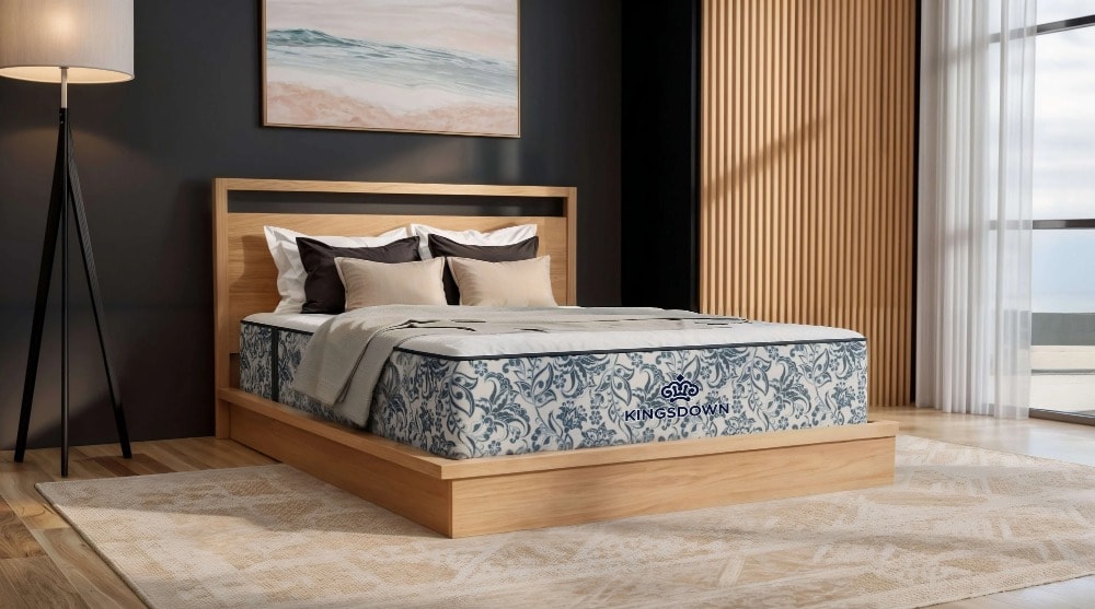 Kingsdown mattress on a light wood toned bed frame