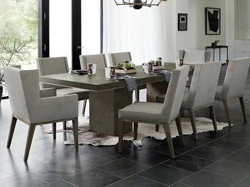 9-piece dining set with 6 upholstered side chairs and 2 upholstered arm chairs and a double pedestal dining table