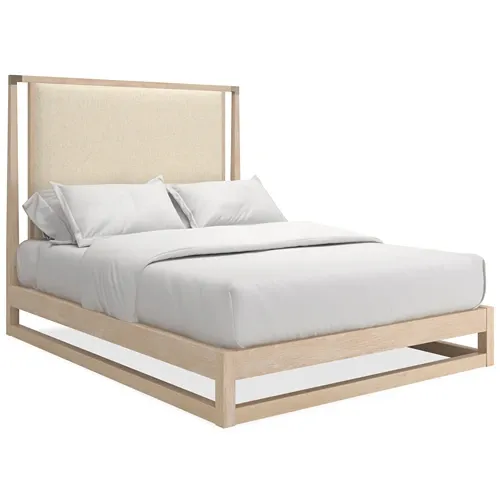 light wood tone platform bed with upholstered headboard