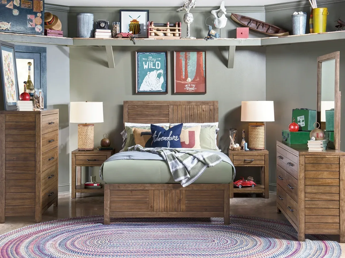medium wood-toned full bed with matching dresser and mirror, chest and two nightstands