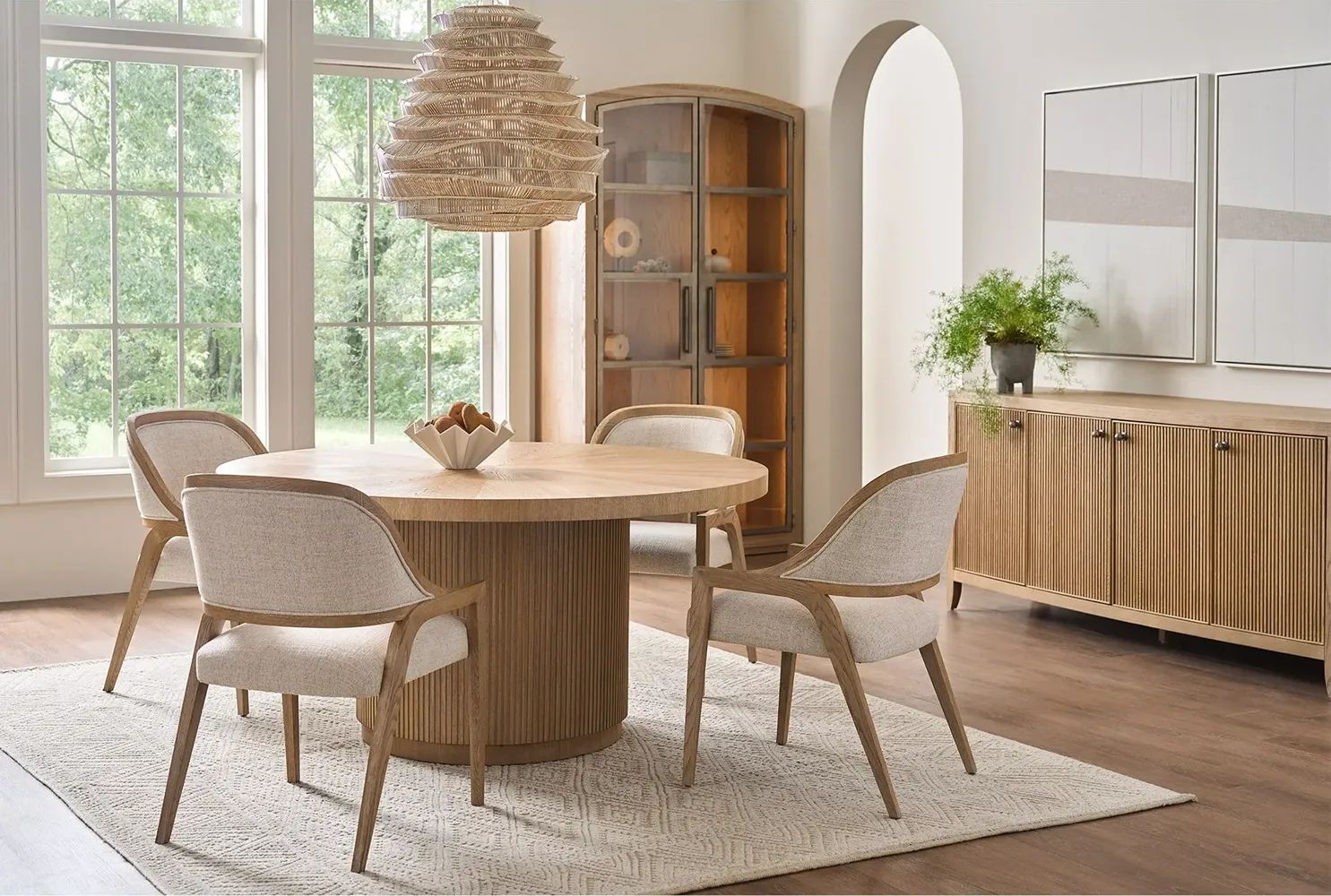 dining room image with table, chairs, credenza and glass-door cabinet