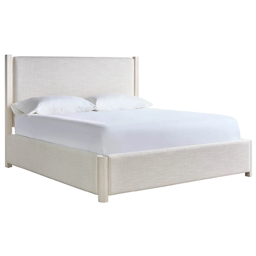 cream upholstered bed