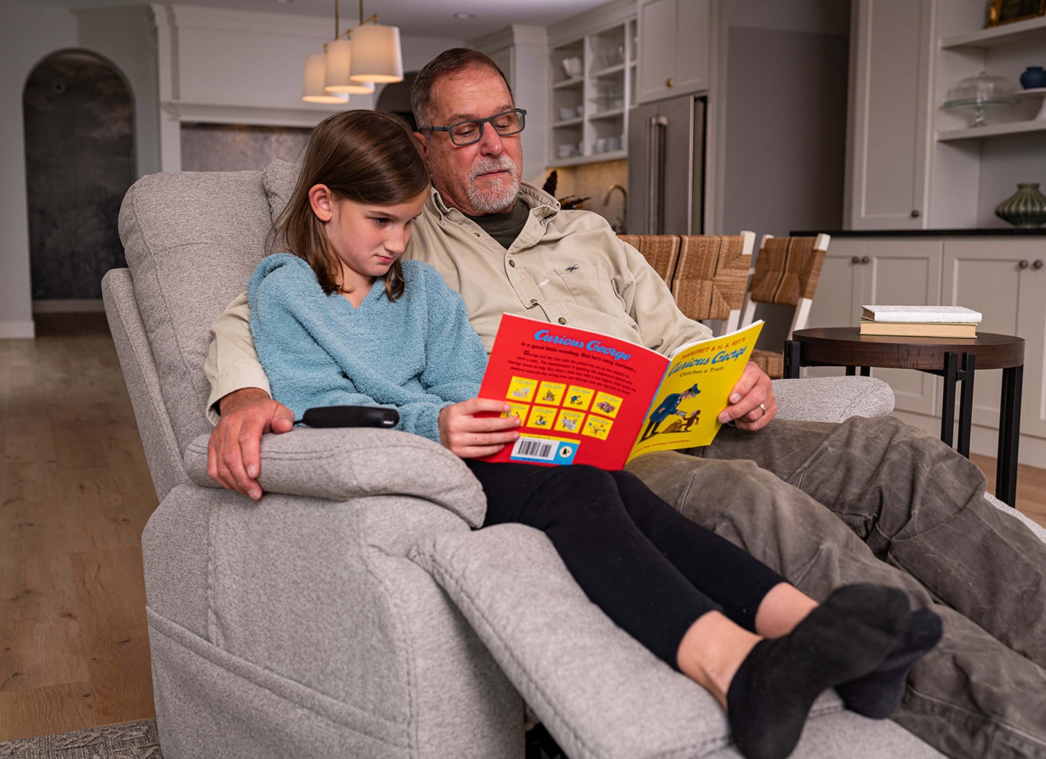 grandpa reading to grandchild