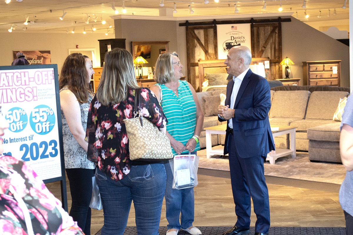 Marty Darvin meets guests at 2019 Wine Tasting Popup Workshop at Darvin Furniture & Mattress