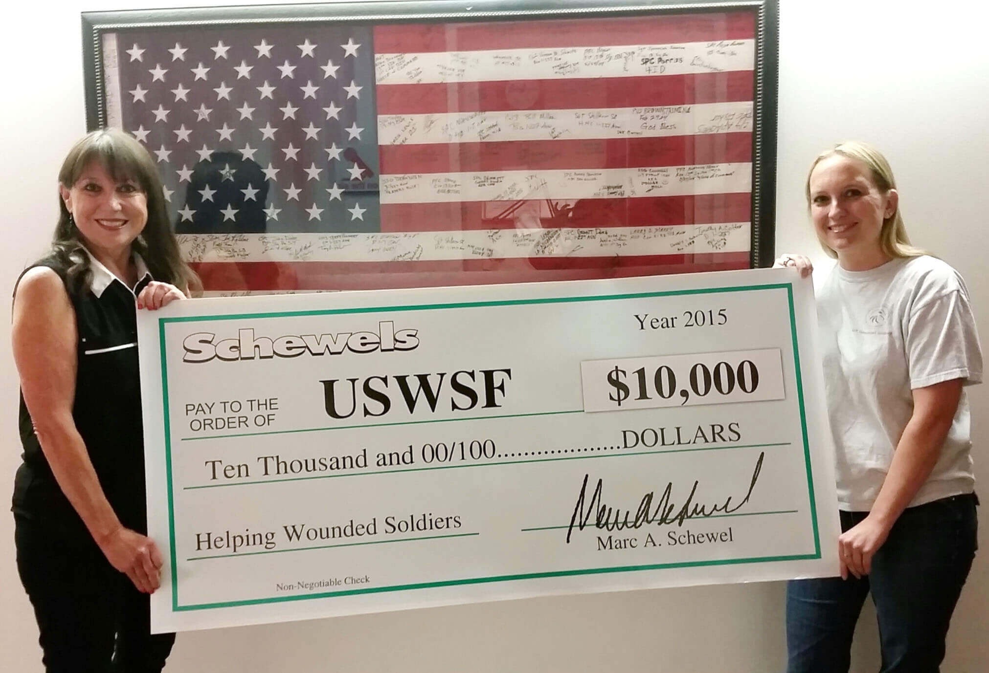 Schewel's Home presenting check to USWSF