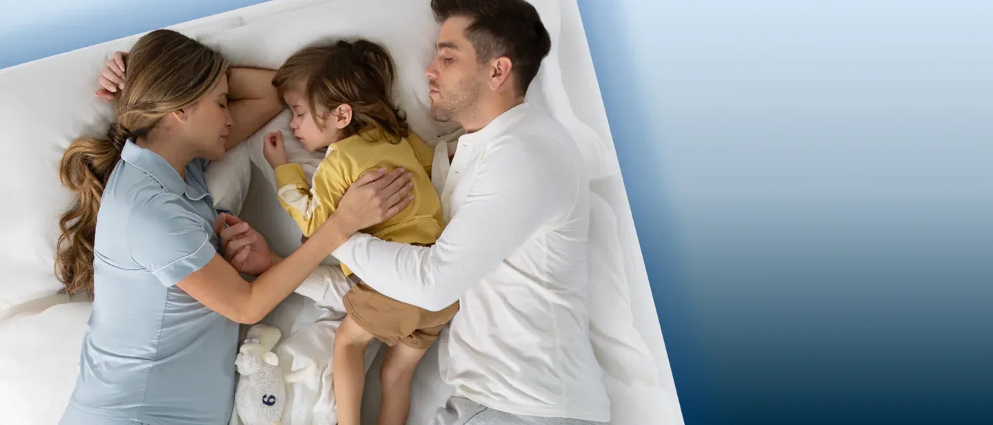 Family Sleeping on a Mattress