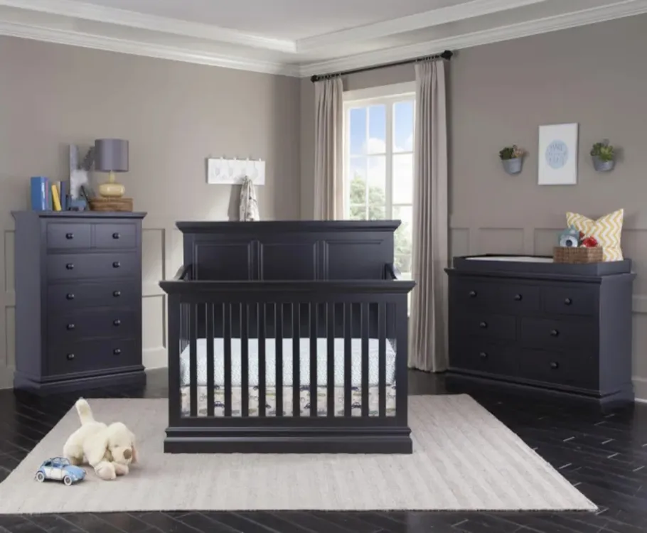Modern dark wooden crib with matching dressers
