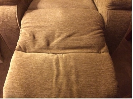 Reclining chair with puddled fabric
