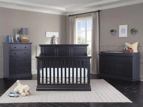 Modern dark wooden crib with matching dressers