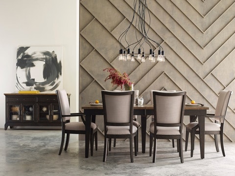 Elegant dining room with long table, chairs, and
sideboard