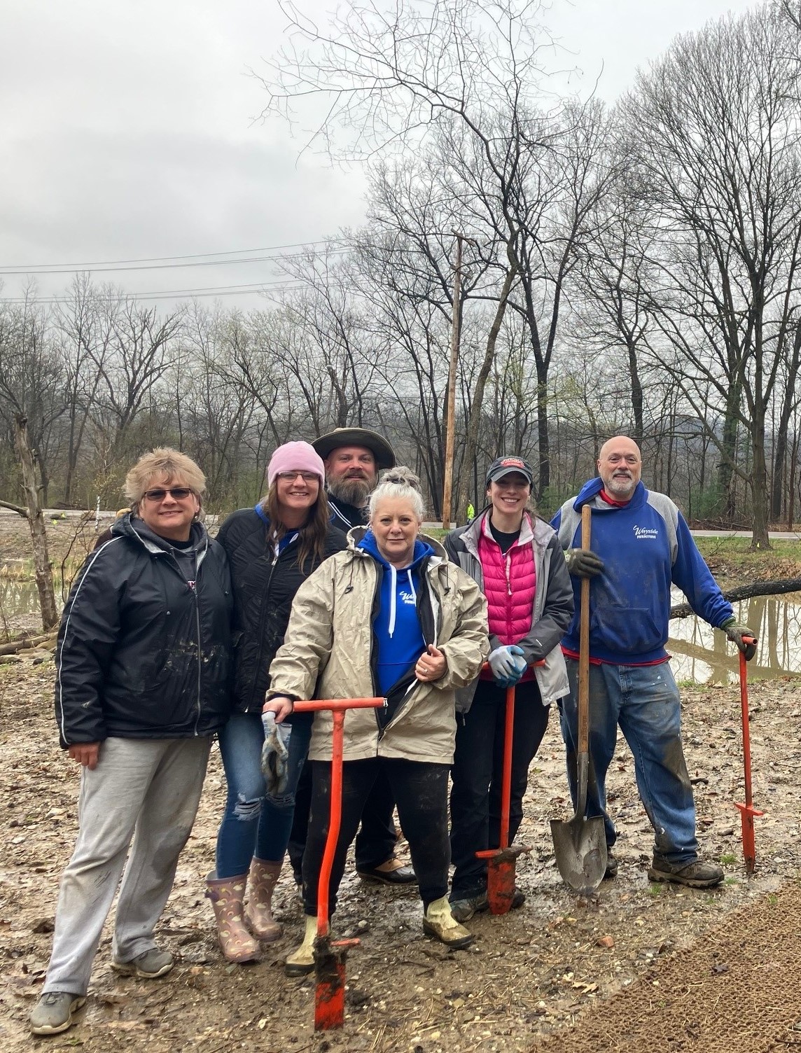Wayside Furniture volunteering with Summit Metro Parks bareroot planting initiative