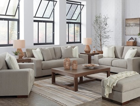 Full grey living room set with a sofa, loveseat, ottoman, and accent chair