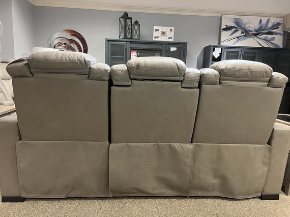 Back view of a reclining sofa with gaps in between the three seats