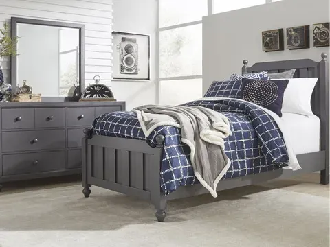 Wooden twin bed with blue bedding