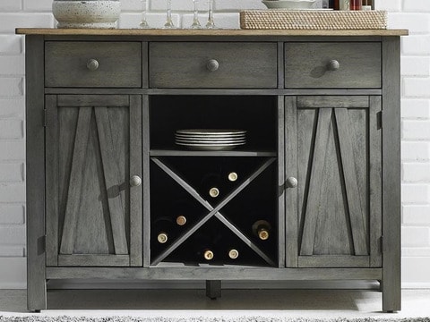 Wooden bed with comforter and fluffy throw blanket