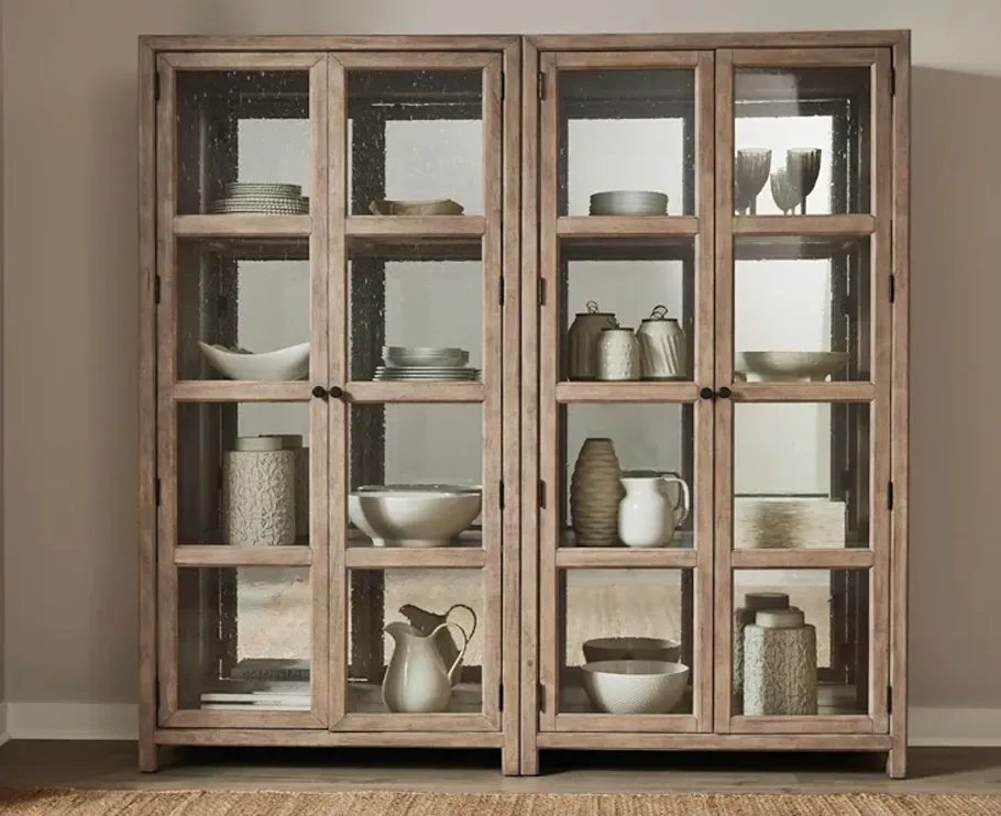 Light wood curio cabinet with glass doors