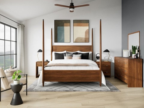 Finished bedroom with matching bed, two nightstands, dresser, and other decor