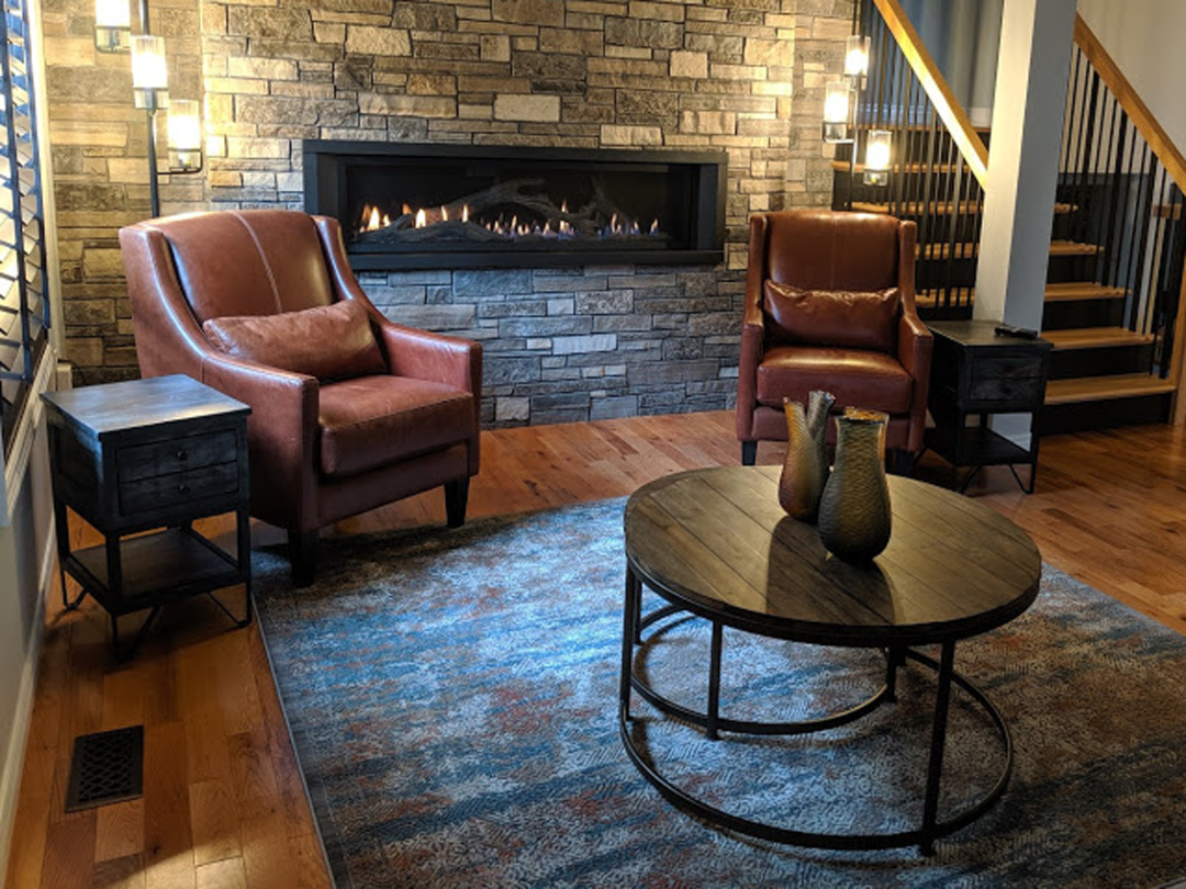 Side chairs in front of fireplace