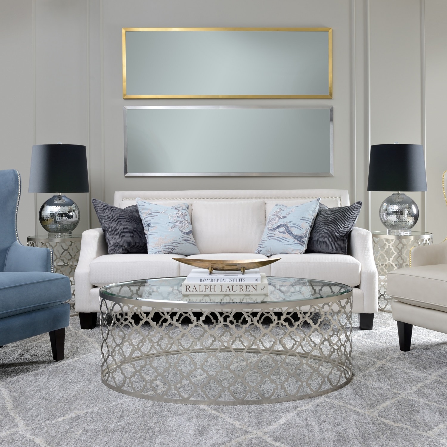 White sofa with mirrors above
