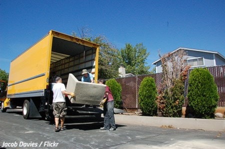 loading sofa into moving van