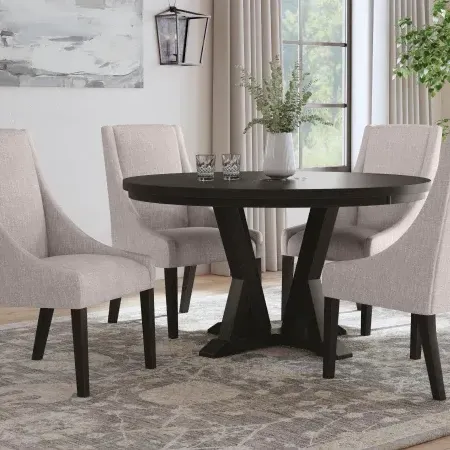 dining room with black table and white chairs