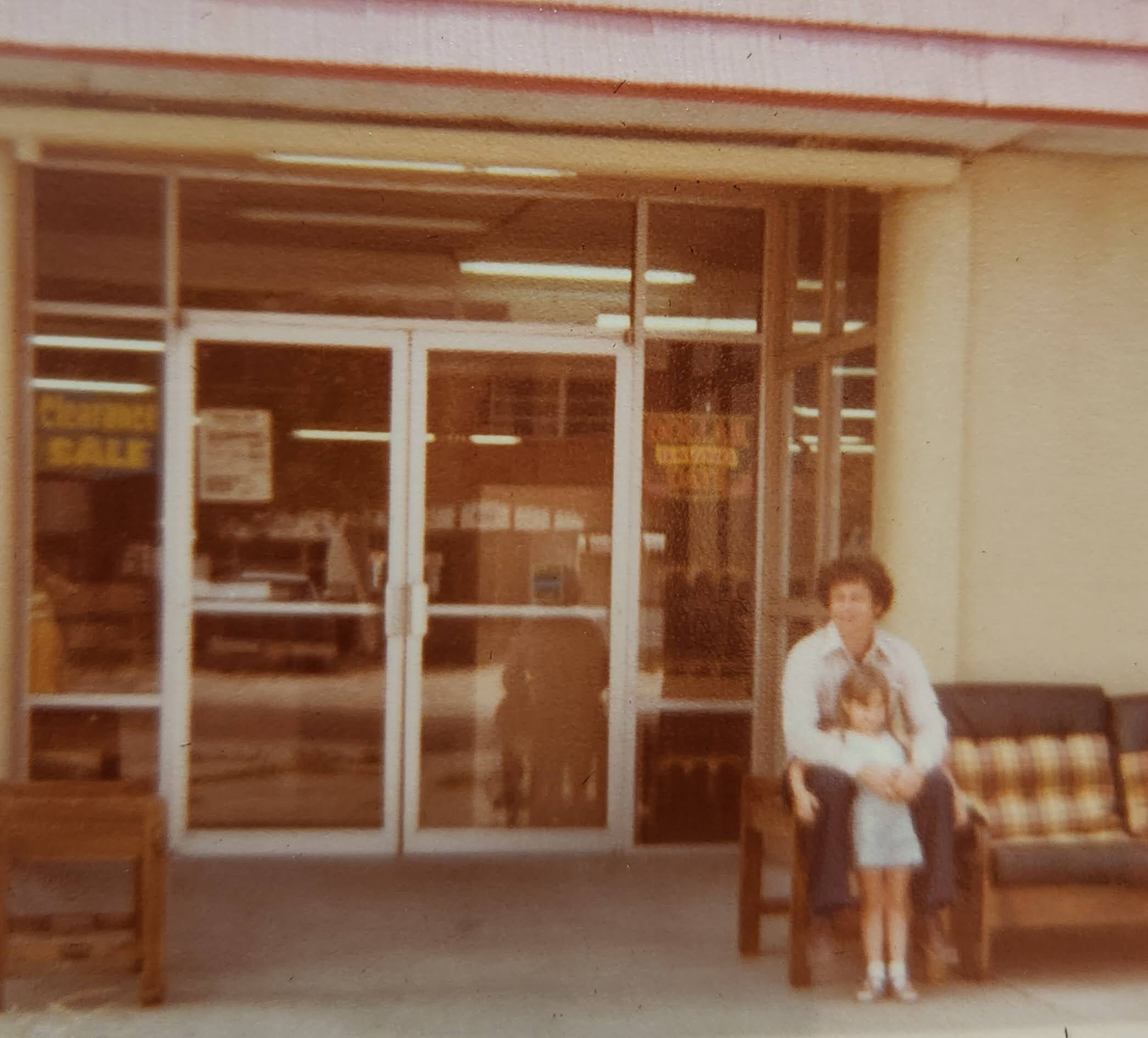 1970s Mike in front of the store