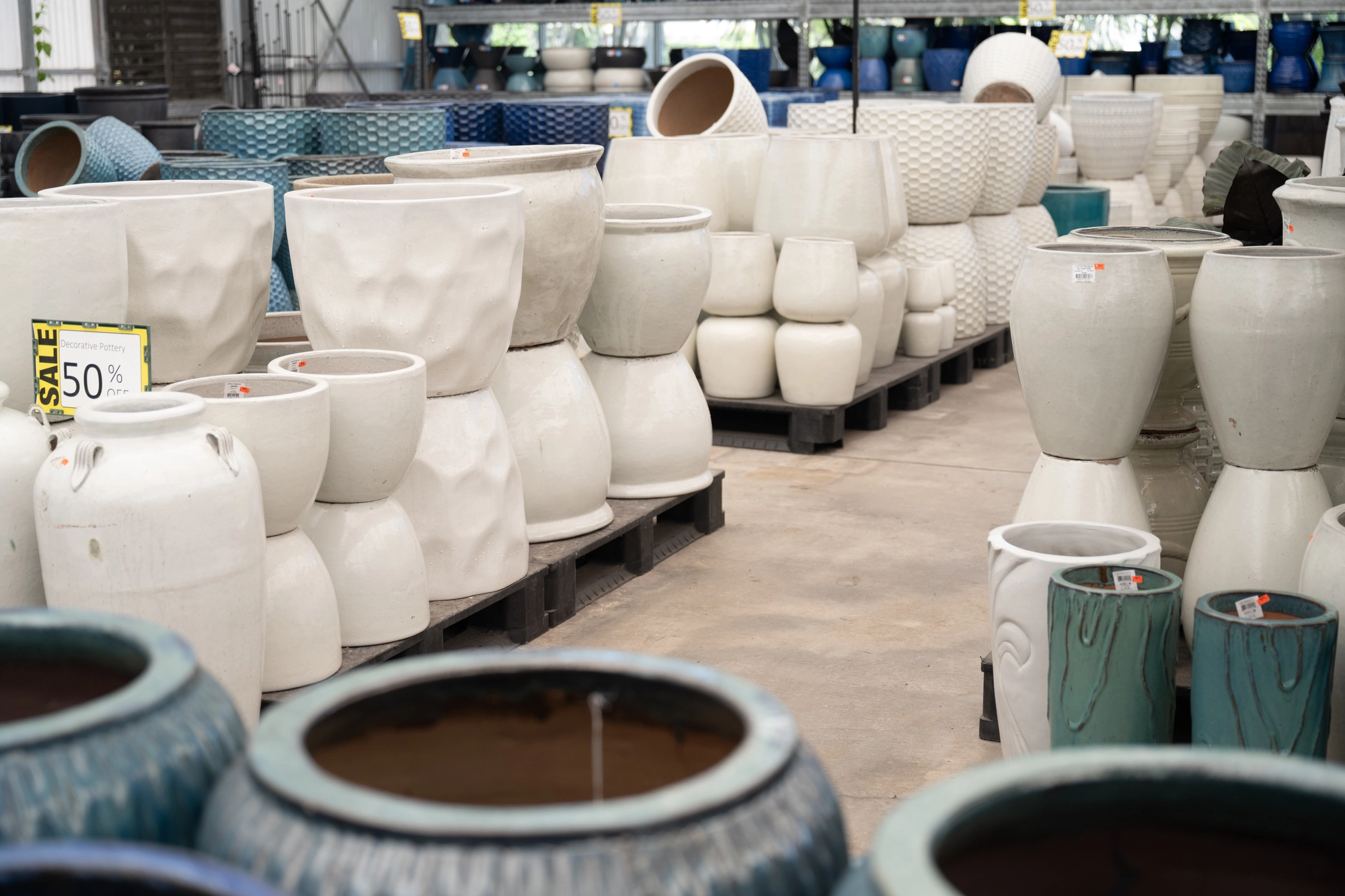 pottery stacked on shelves
