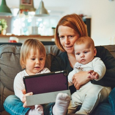Mom reading with her children