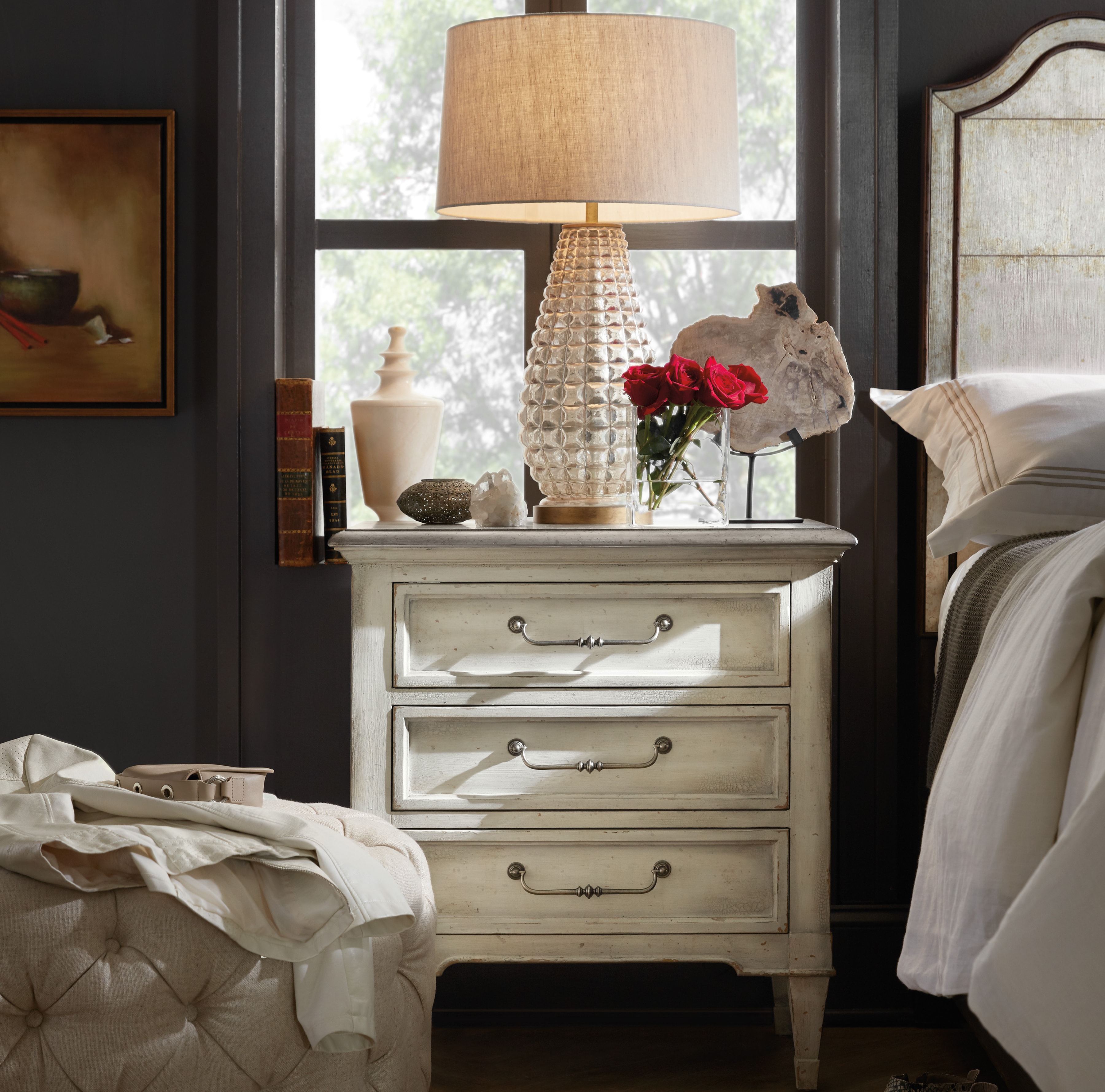 man and woman sitting on bed