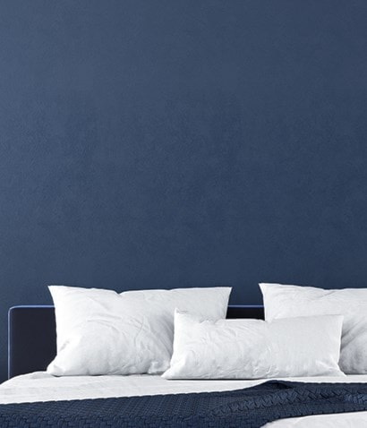 dark blue wall and mattress