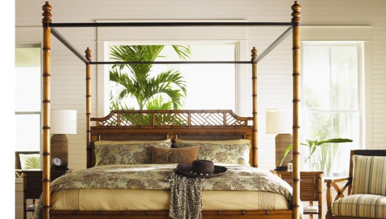 Beautiful bamboo and rattan bed in tropical bedroom. 