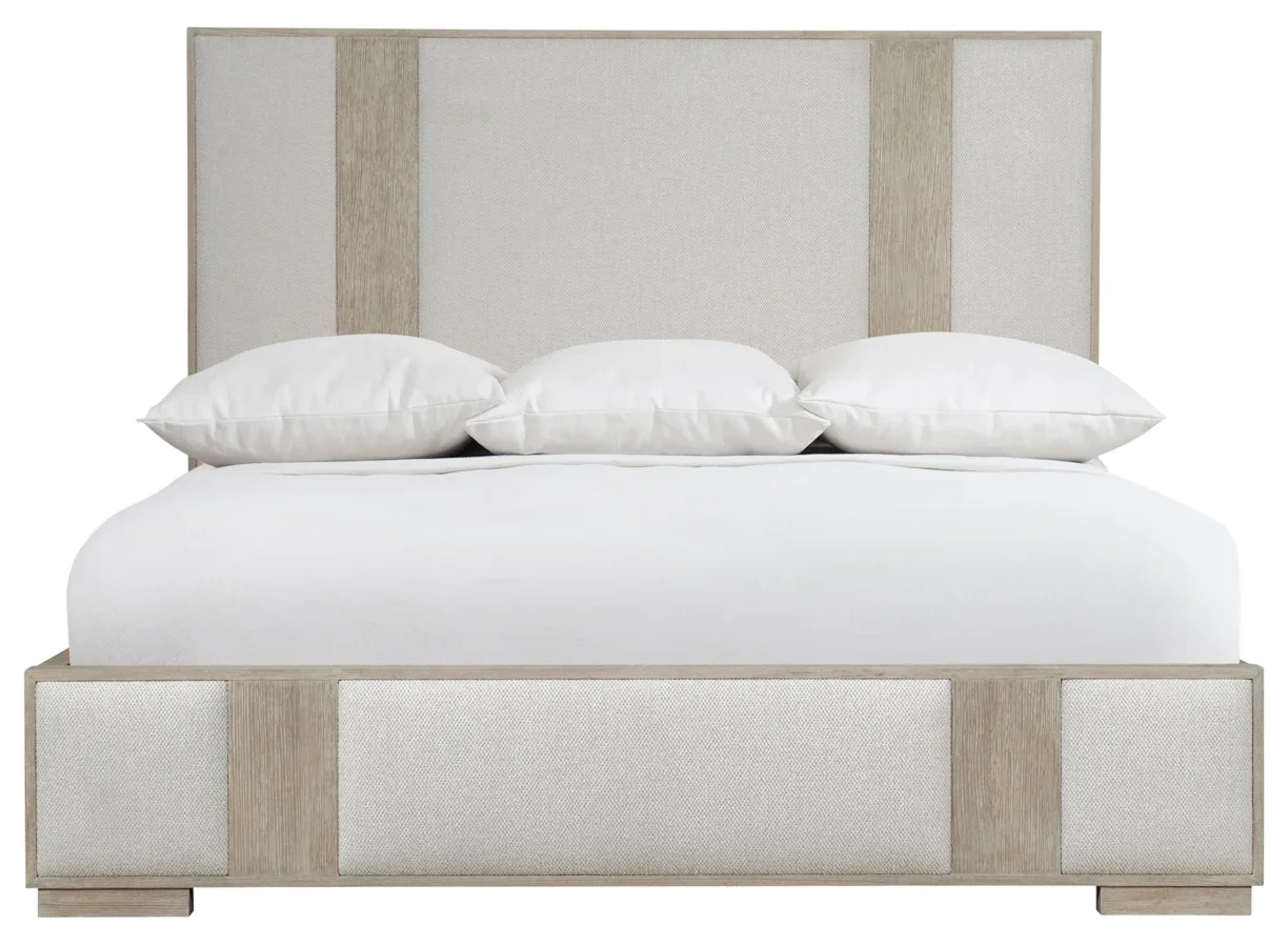 Padded bed with linear wood features. 