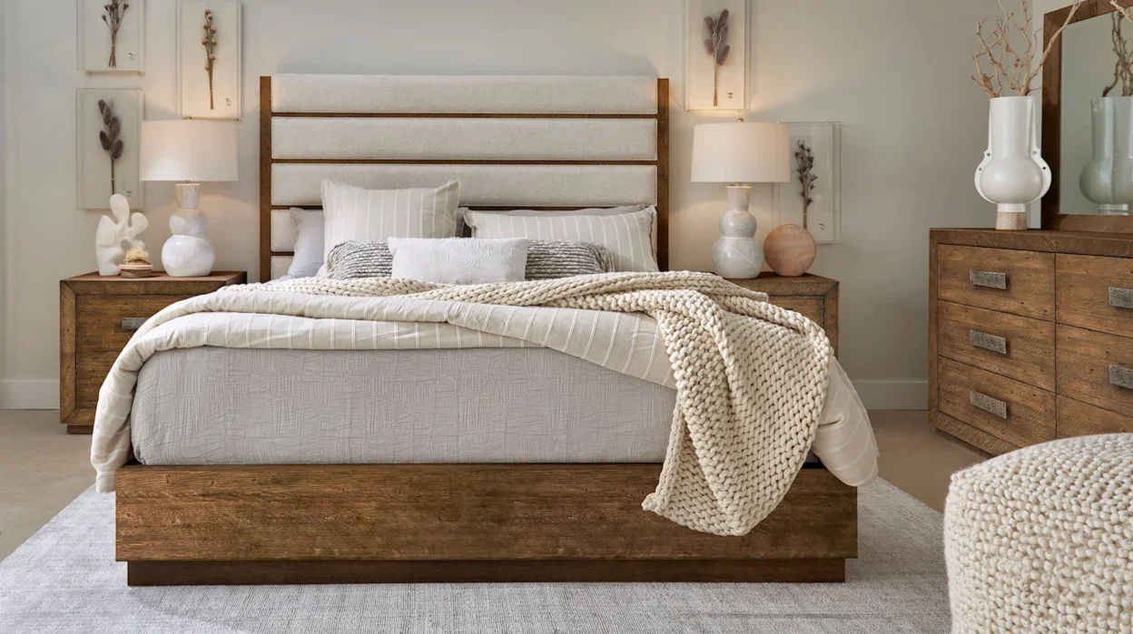 Fashionable transitional bedroom with padded bed headboard. 