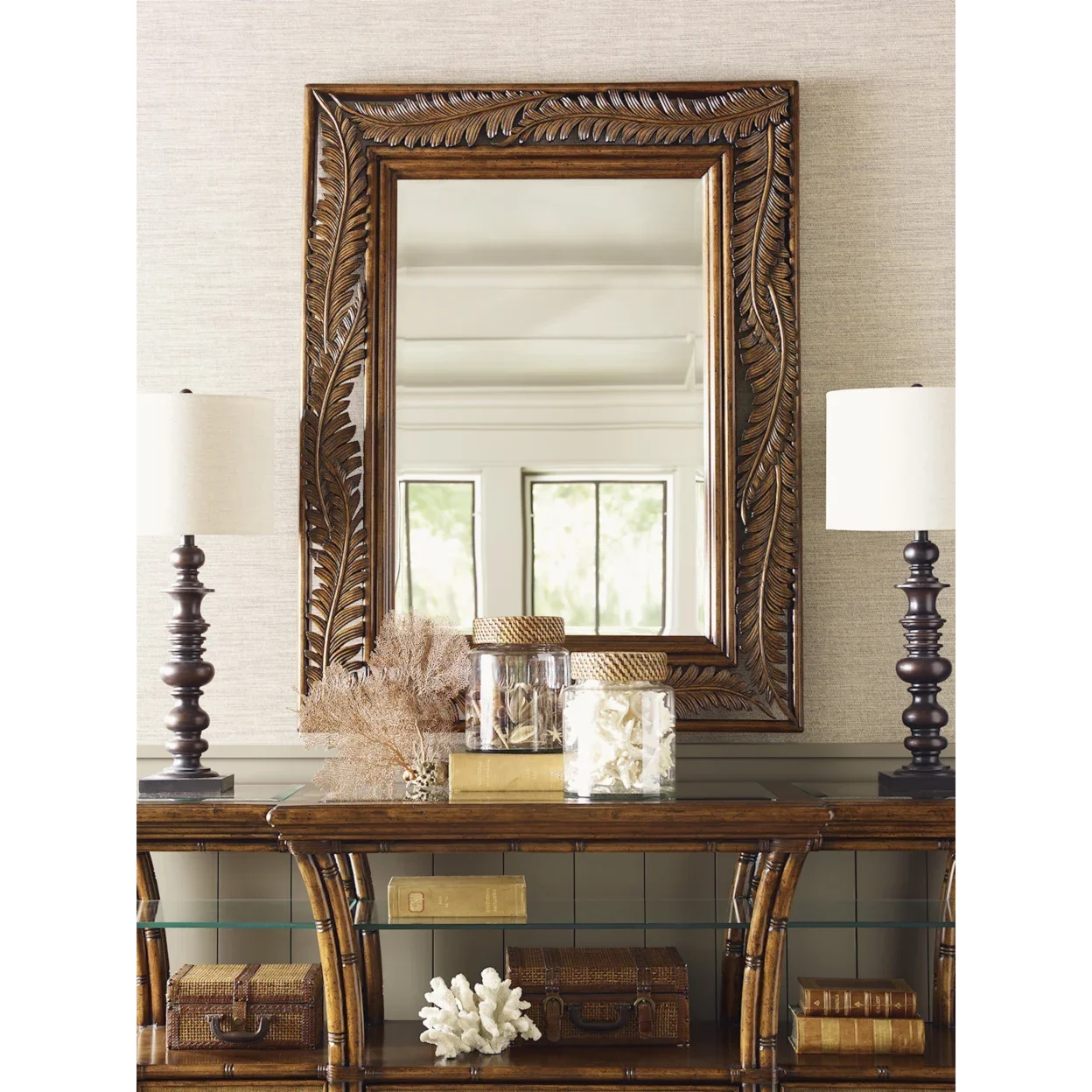 Tommy Bahama wall mirror with a tropical pattern wood frame. 