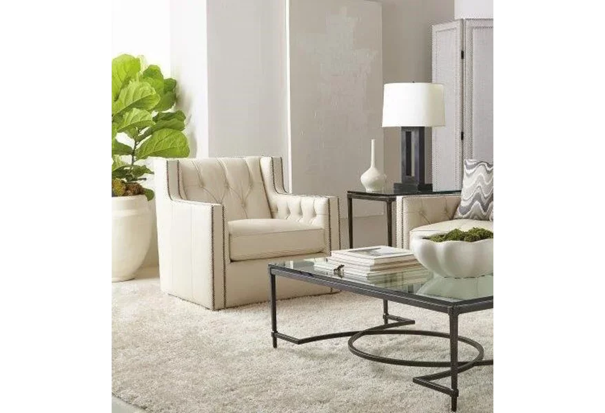 A beautiful cream-colored swivel chair in a partial living room view. 