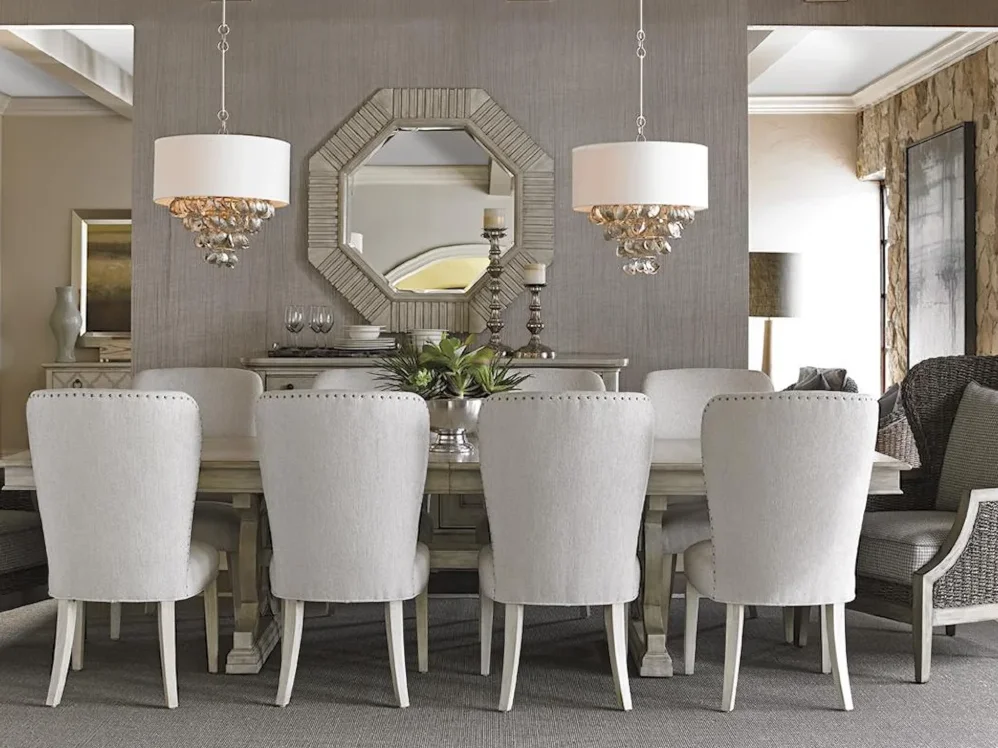 Beautiful dining room with white upholstered chairs. 